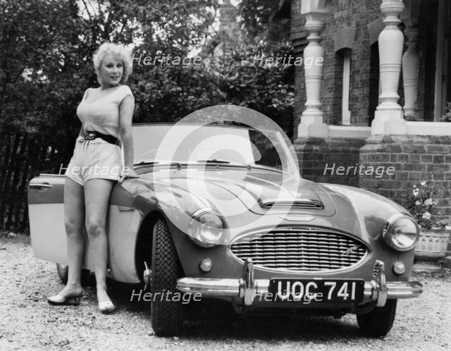 1957 Austin - Healey 100-6 with model. Creator: Unknown.