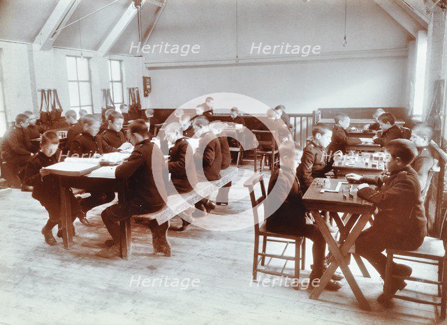 Boys playing dominoes and reading at the Boys Home Industrial School, London, 1900. Artist: Unknown.