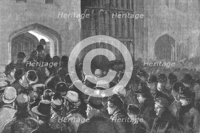 ''Distributing the Queen's New Year Gifts at Windsor; The crowd outside the Riding School...', 1890. Creator: Unknown.