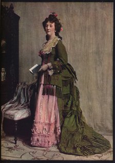 'An afternoon dress of green and pink silk. Very typical of the modes between 1868 and 1878', c1913. Artist: Unknown.