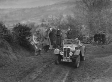 Austin 7 Grasshopper of TH Cole competing in the MG Car Club Midland Centre Trial, 1938. Artist: Bill Brunell.