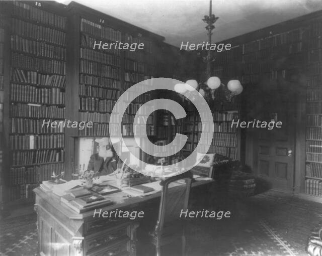George Bancroft, 1800-1891, half-length portrait, seated at desk in library, facing front, c1880s. Creator: Unknown.