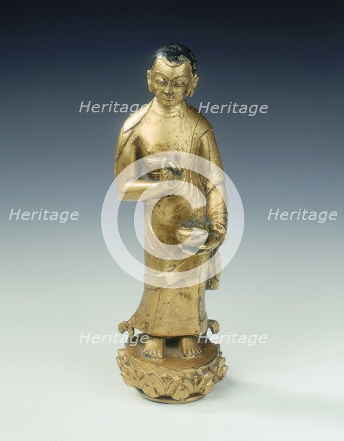 Gilt bronze statue of a standing monk with begging bowl, Yuan dynasty, China, 14th century. Artist: Unknown
