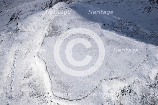 Ingleborough Iron Age univallate hillfort and hut circle earthworks in the snow, N Yorkshire, 2018. Creator: Emma Trevarthen.