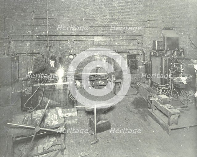 Men welding, Charlton Central Repair Depot, London, 1932. Artist: Unknown.