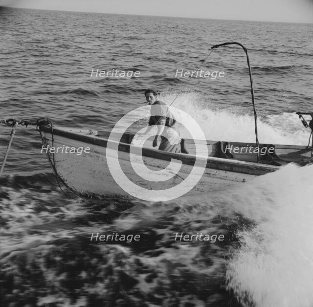 Giacomo Frusteri in the prow of the seining boat as it races to..., Gloucester, Massachusetts, 1943. Creator: Gordon Parks.