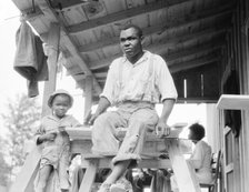 Evicted Arkansas sharecropper, now building his new home at Hill House, Mississippi, 1936. Creator: Dorothea Lange.