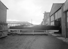 Cabin cruiser D.G.S.I. on stand at boatyard, 1913. Creator: Kirk & Sons of Cowes.