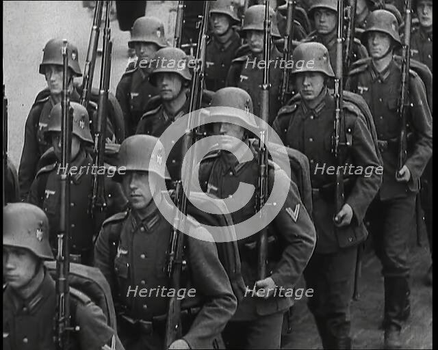 A Regiment of Male German Soldiers Marching Along a German Street, 1939. Creator: British Pathe Ltd.