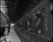 Male Members of the British Expeditionary Force Leaning Out of the Carriages as a Train is..., 1939. Creator: British Pathe Ltd.