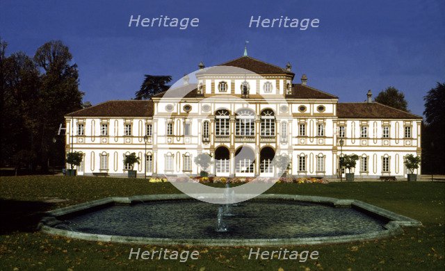View of the exterior of the building and gardens of the Treasury Villa.