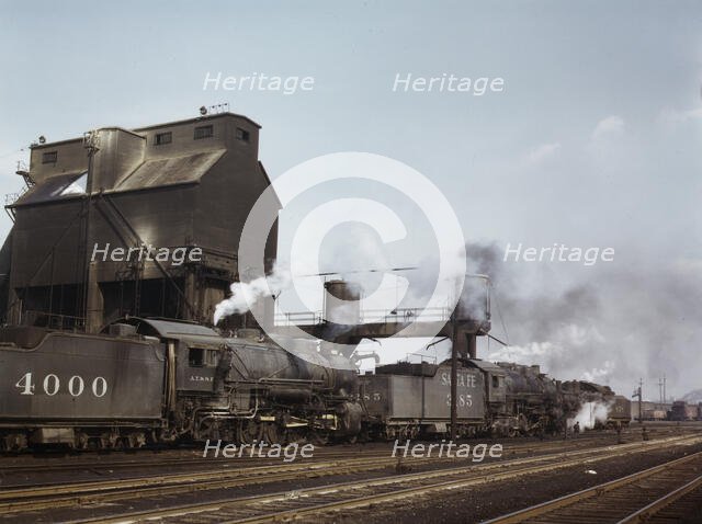 Servicing engines at coal and sand chutes at Argentine yard, Santa Fe R.R., Kansas City, 1943. Creator: Jack Delano.