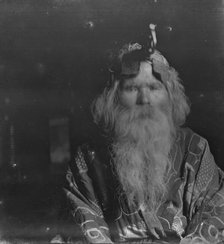 Ainu chief wearing a headdress, 1908. Creator: Arnold Genthe.