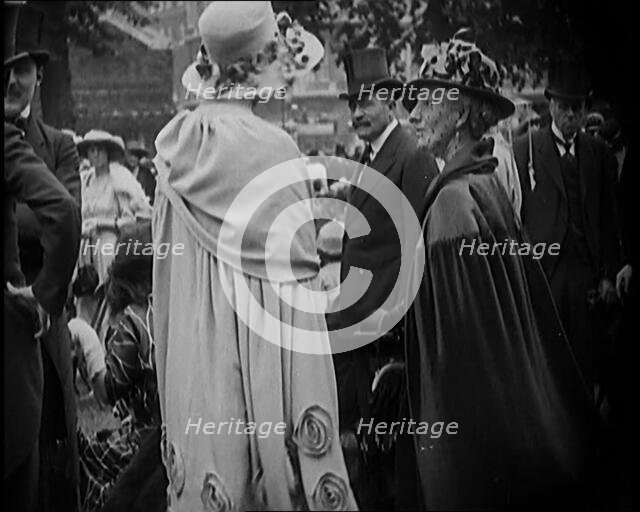 Civilians on the Street Wearing Evening Outfits, Hats and Top Hats, 1920. Creator: British Pathe Ltd.