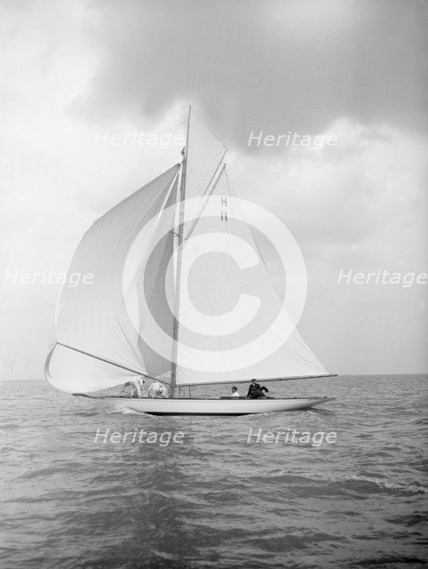 The 8 Metre 'Ventana' (H11) sailing with spinnaker, 1912. Creator: Kirk & Sons of Cowes.