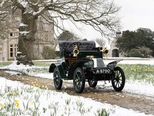 1904 De Dion Bouton model Q in snow with daffodils at Beaulieu. Creator: Unknown.