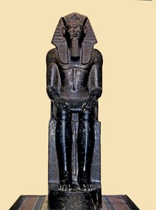 Front view of the seated statue of Ramses II, made in diorite, it comes from Tanis.