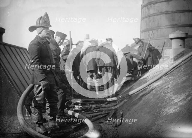 Putting out fire in Bain News Service Bldg. 1/6/12, 1912. Creator: Bain News Service.