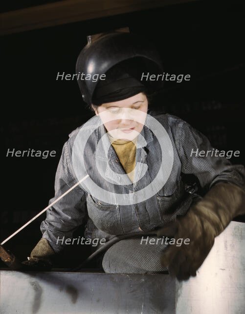 Enola O'Connell, age 32, widow and mother of one child...Heil and Co., Milwaukee, Wisc., 1943. Creator: Howard Hollem.