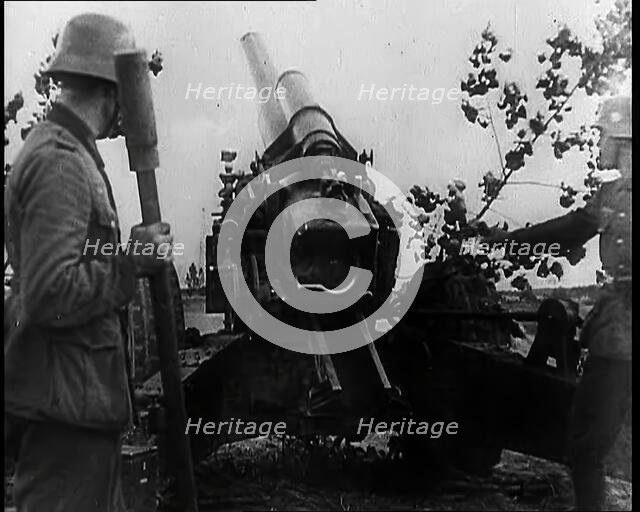 Two Male German Soldiers by an Artillery Gun, 1939. Creator: British Pathe Ltd.