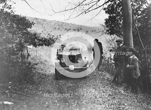 Morris Minor tourer of JE Clowes competing in the Inter-Varsity Trial, November 1931. Artist: Bill Brunell.