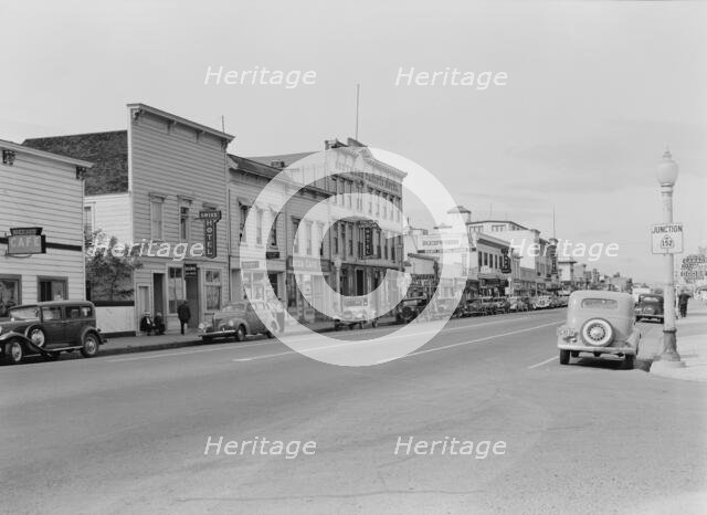 Up the main street of a valley town, Gilroy, California, 1938. Creator: Dorothea Lange.