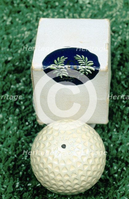 Golf ball and box, c1910. Artist: Unknown