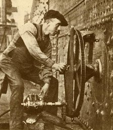 'A Pneumatic Riveter Cutting Portholes in the Side of a Liner', c1930. Creator: John Brown & Company.