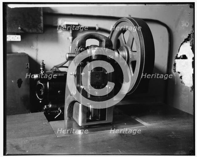 Stamping machine at Treasury, between 1910 and 1920. Creator: Harris & Ewing.