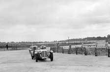 Cars racing through the chicane, JCC Members Day, Brooklands, 8 July 1939. Artist: Bill Brunell.
