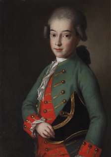 Portrait of a boy wearing a green kaftan.