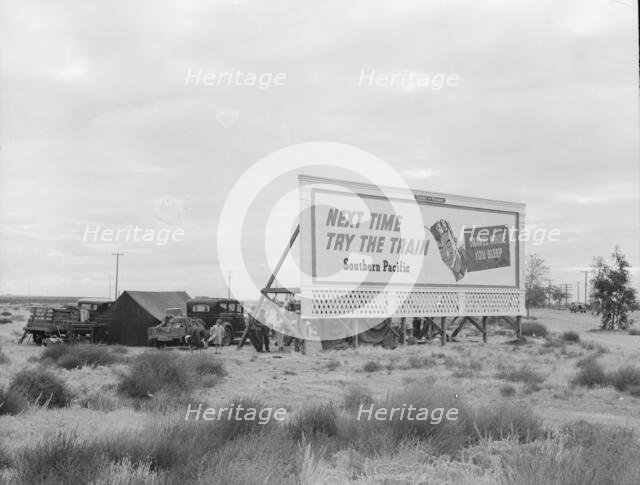 Camped in the rain behind billboard...on U.S. 99, near Famosa, Kern County, California, 1939. Creator: Dorothea Lange.