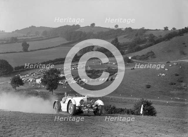 Aston Martin competing in the Singer CC Rushmere Hill Climb, Shropshire 1935. Artist: Bill Brunell.