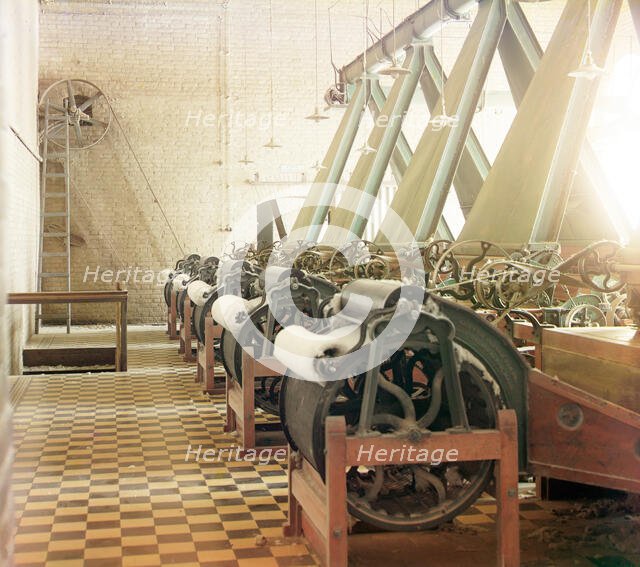 Cotton textile mill interior with machines producing cotton thread..., between 1905 and 1915. Creator: Sergey Mikhaylovich Prokudin-Gorsky.