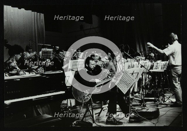 Michael Garrick conducting an orchestra at Berkhamsted Civic Centre, 1985. Artist: Denis Williams