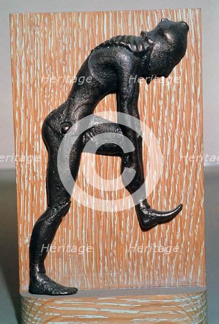 Greek bronze hoplite putting on armour, 5th century BC. Artist: Unknown