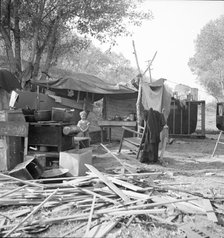 Destitute family, American River camp, Sacramento, California., 1936. Creator: Dorothea Lange.
