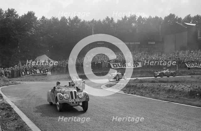 LG Johnson's Frazer-Nash BMW 328 leading two MG PBs, Imperial Trophy, Crystal Palace, 1939. Artist: Bill Brunell.