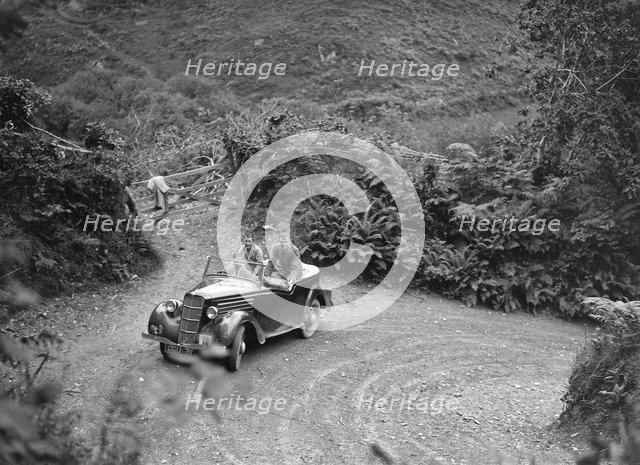 1935 Ford Ten tourer taking part in a motoring trial, late 1930s. Artist: Bill Brunell.