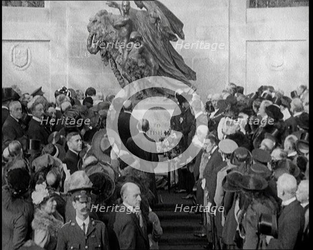 French and British Crowd Watching as a Union Flag and Tricolore Are Removed to Reveal..., 1920. Creator: British Pathe Ltd.