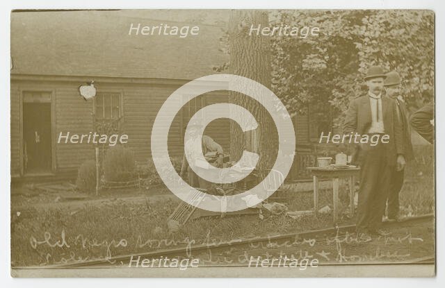 'Old Negro saving few articles after mob violence. Many went destitute + homeless', 1908. Creator: Unknown.