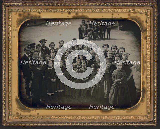 Large group of school children, with their teacher, standing in a town street, ca. 1850s. Creator: Unknown.