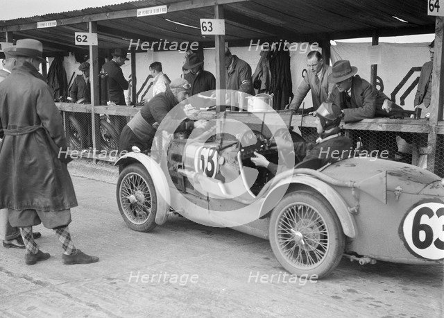 MG C type of TVG Selby and G Hendy in the pits at the JCC Double Twelve race, Brooklands, May 1931. Artist: Bill Brunell.