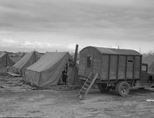 In mobile camp at end of season, cold day, FSA camp, Merrill, Klamath County, Oregon, 1939. Creator: Dorothea Lange.