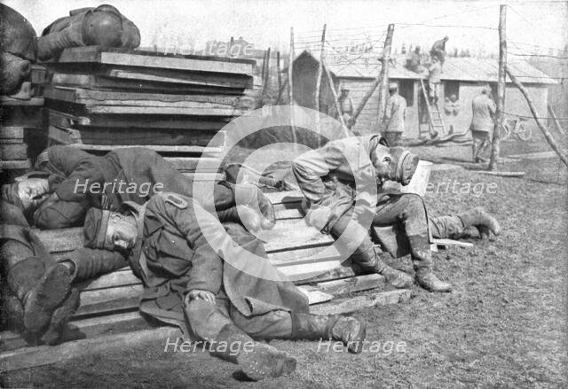 'Les "Leurs", apres la bataille: prisonniers allemands extenues, ecrases par le sommeil..., 1918. Creator: Unknown.