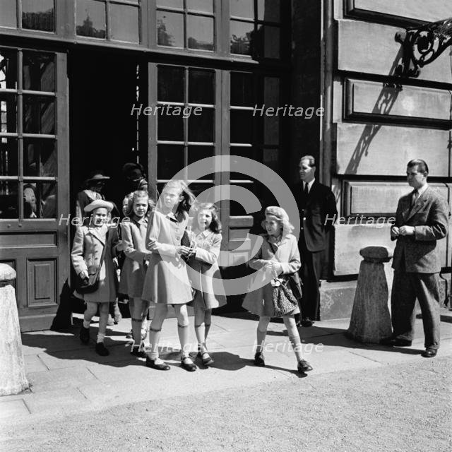 Princesses Birgitta, Margaretha and Desiree on their way from the Castle School, 24/5 1946. Creator: Unknown.