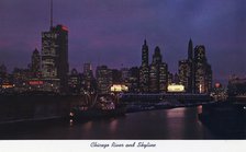 Chicago River and city skyline at night, Illinois, USA, 1957. Artist: Unknown