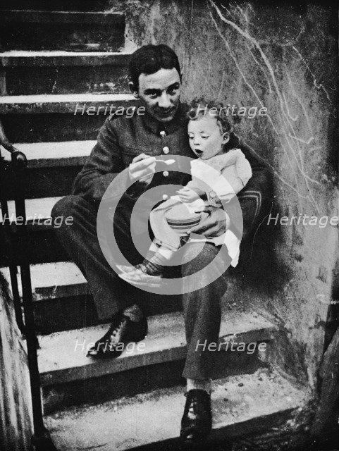 'One of the New Army making himself useful in his billet', 1915. Artist: Unknown.