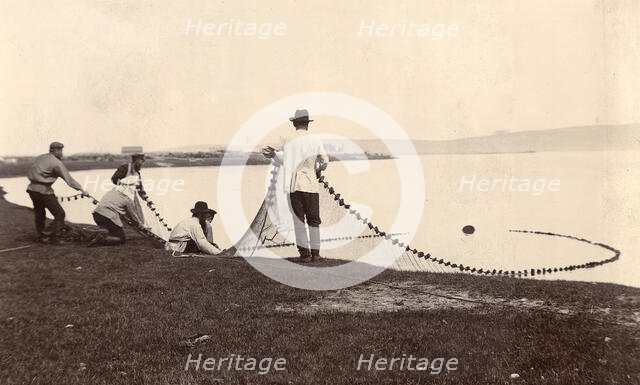 Fishermen with a net in their hands, 1900. Creators: I. A. Podgorbunskii, V. I. Podgorbunskii.