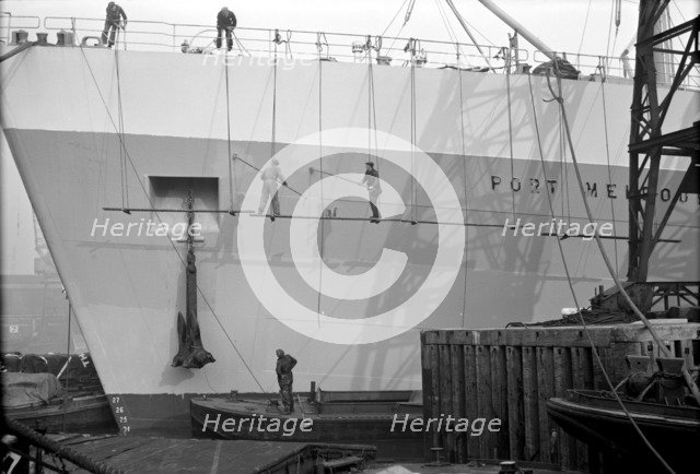 Men painting a vessel, Tilbury, Essex, c1945-c1965. Artist: SW Rawlings